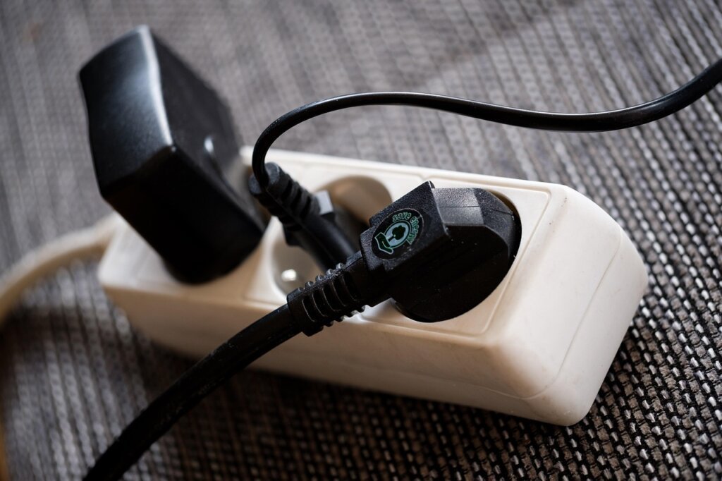 power strip with individual switches plugged into wall outlet