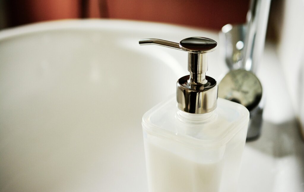 bathroom drain clogged with hair and soap residue