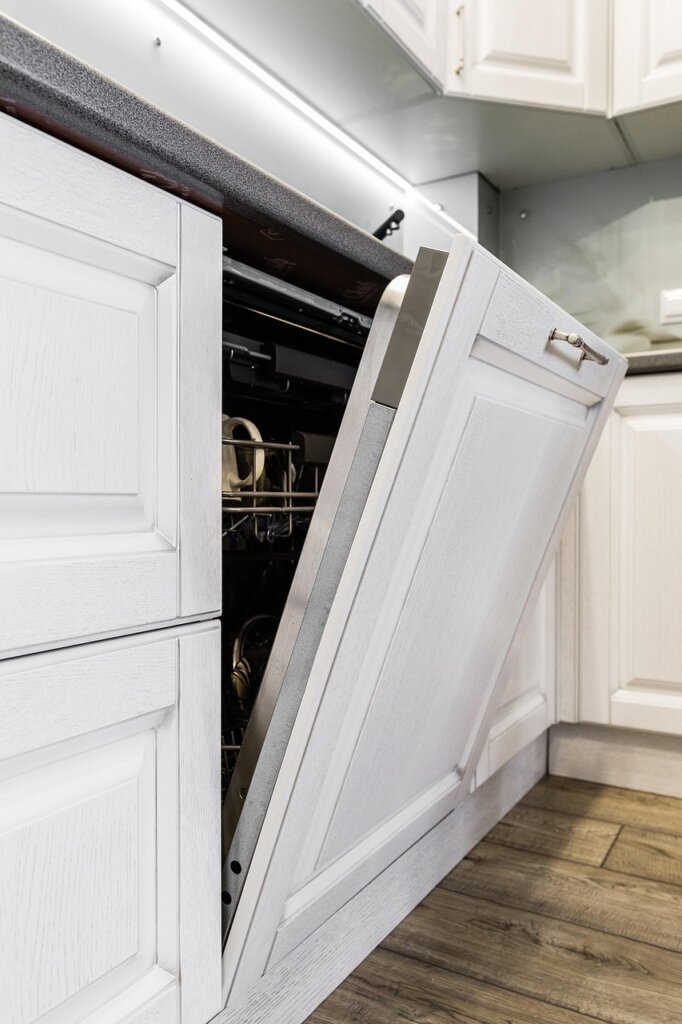 dishwasher interior with food residue on filter