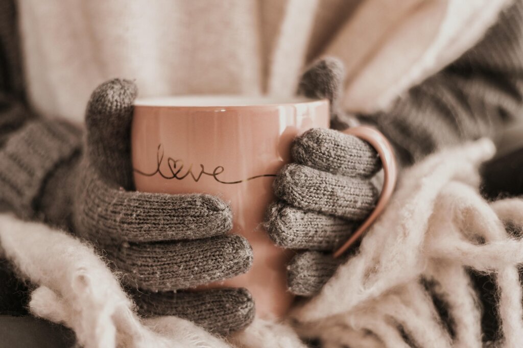 bowl of lukewarm water with hair conditioner and a shrunken wool sweater