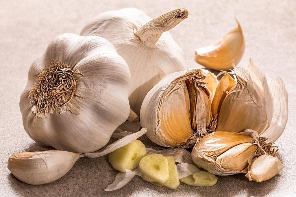 garlic cloves spread flat in zip-lock freezer bag