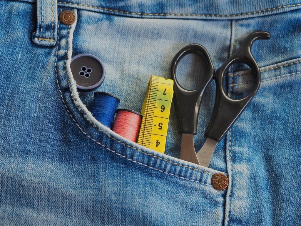 removing sticker residue from fabric clothing using tape method