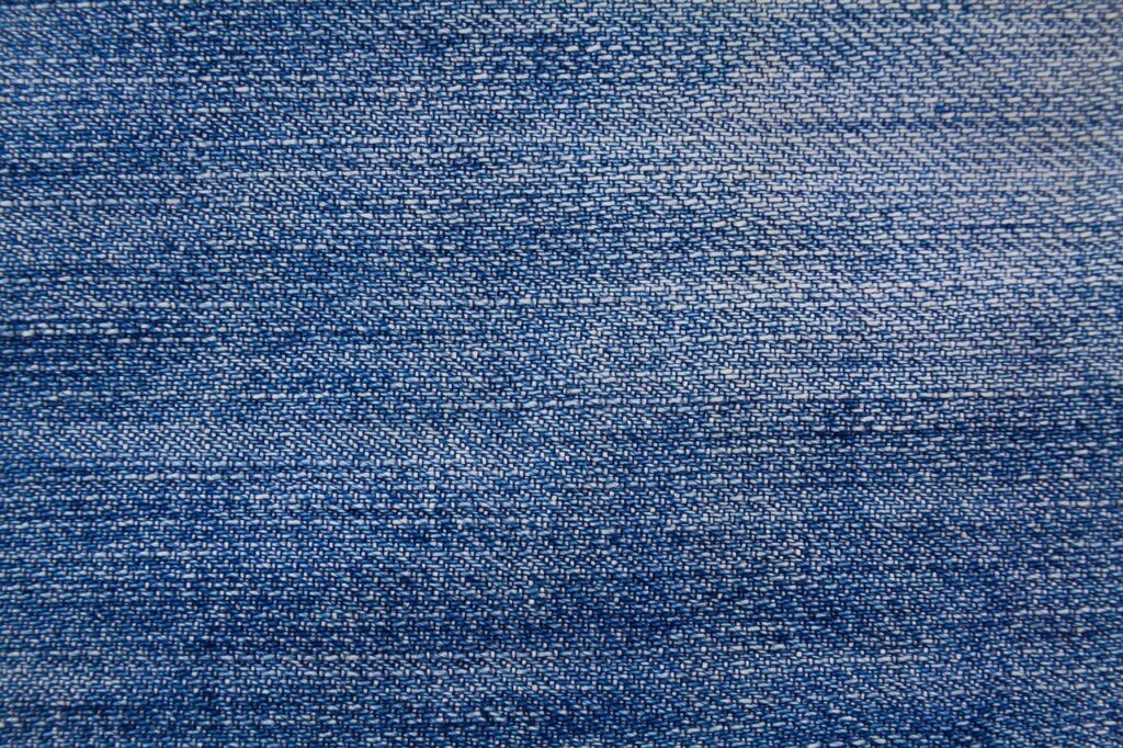 checking fabric care label on clothing before applying solvent