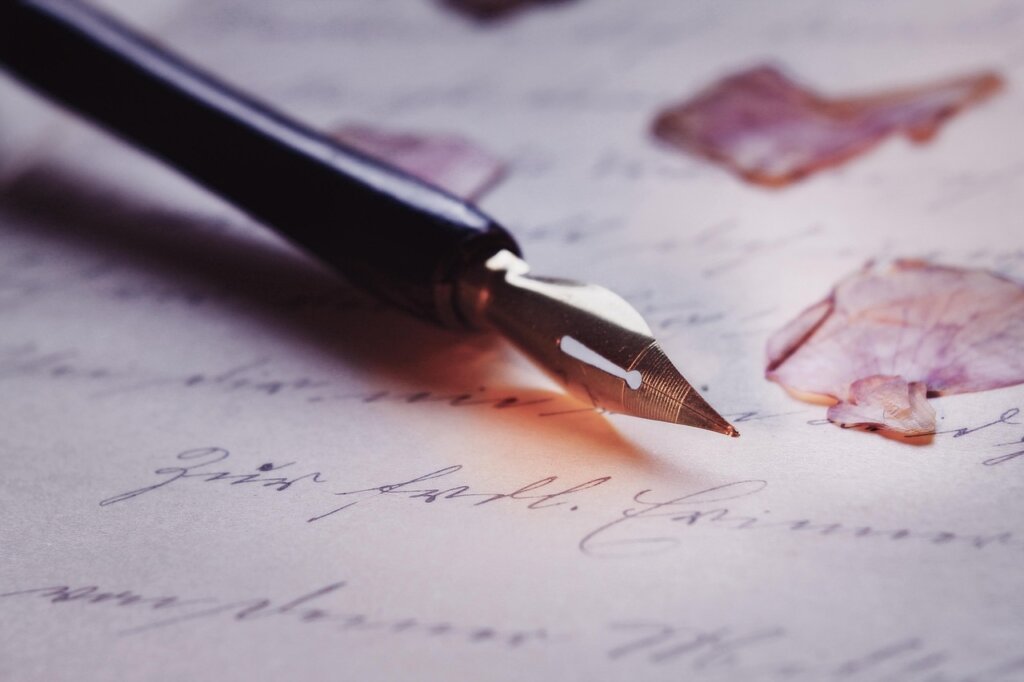 different types of ink pens arranged on white fabric