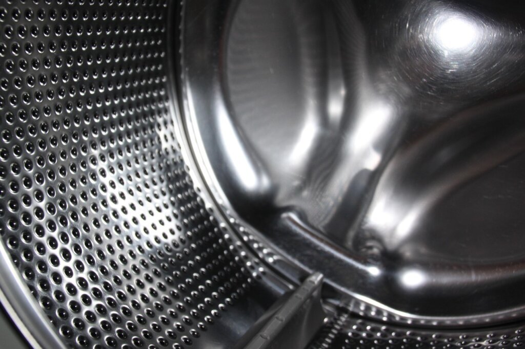 overloaded washing machine drum with too many towels