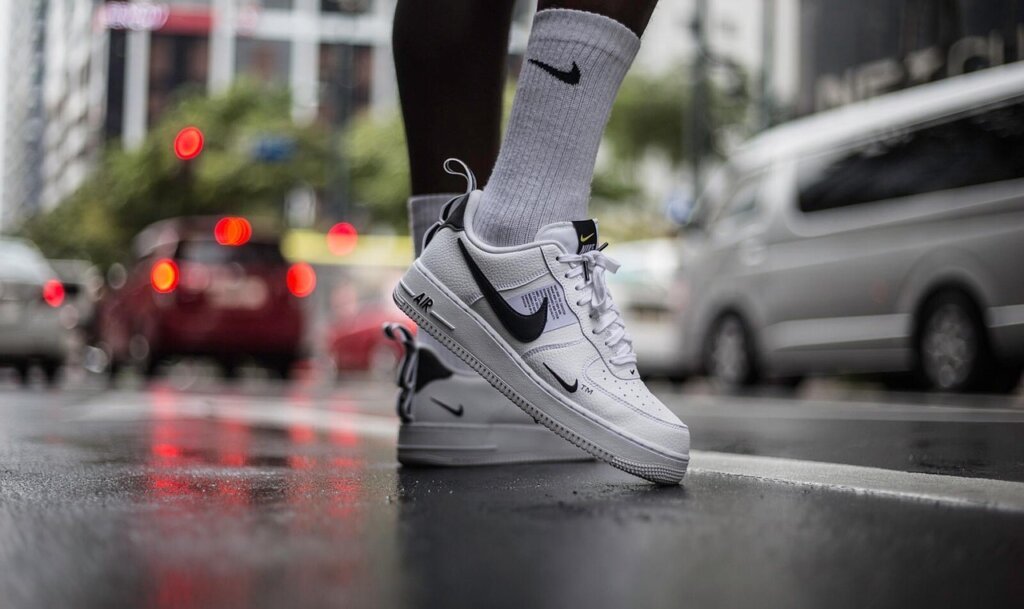 white sneakers drying in shade outdoors