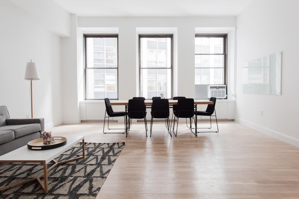 living room rug placed diagonally creating visual depth in small space