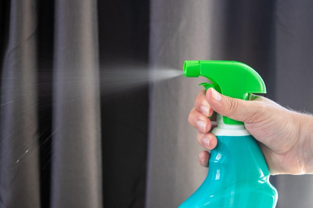 comparison of baking soda jar and chemical drain cleaner bottle
