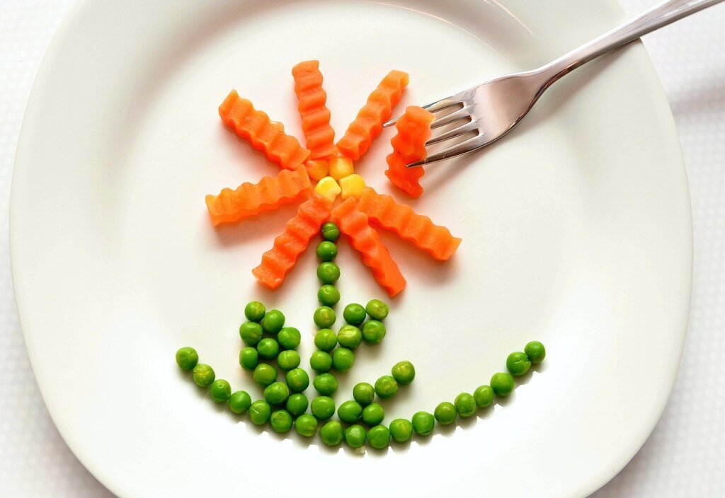 frozen food defrosting slowly in refrigerator on plate